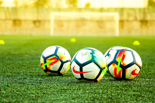 Soccer balls on a practice field